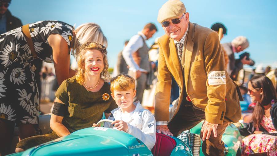 All generations enjoying J40 pedal cars at Goodwood Revival.