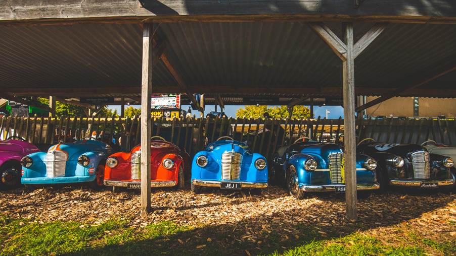 All J40 pedal cars in a row at Goodwood Revival.